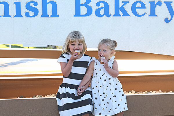 kids enjoying a slice of kringle