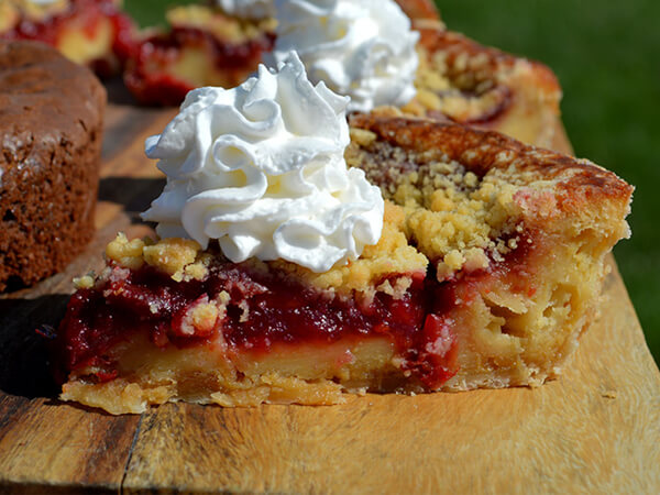 Cherry Bread Pudding topped with whipped cream