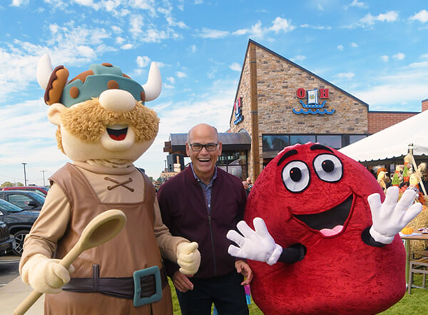 Eric Olesen and company mascot Ohlaf at O&H Bakeryâs 70th Celebration