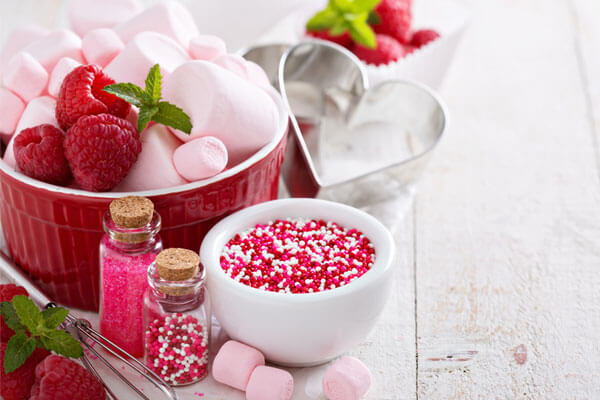 Pink marshmallows, raspberries, sprinkles, and a heart-shaped cookie cutter
