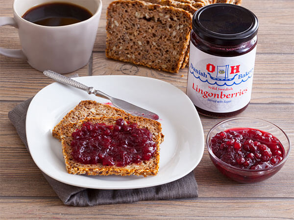 Sliced Danish grain bread with lingonberry jam 