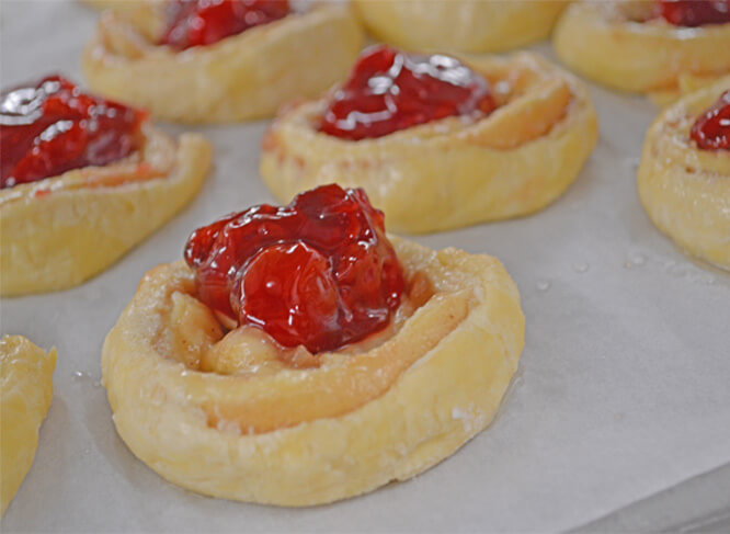 Cherry sweet rolls being prepared