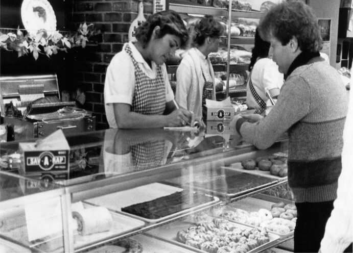Customer ordering bakery - historical photo