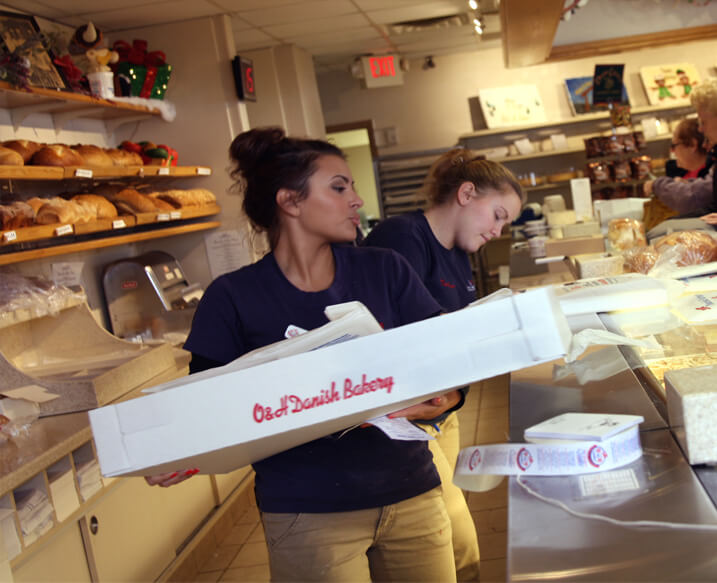 Workers bringing the tasty goods to customers