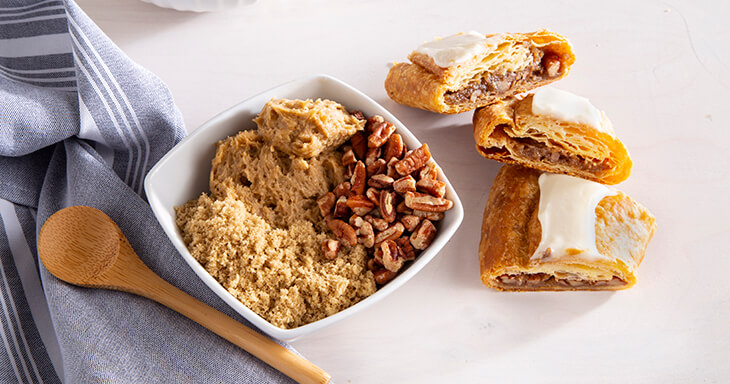 Close-up of O&H Danish Bakery Pecan Kringle Filling and Slices.