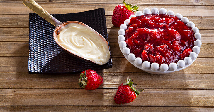 Delight in the creamy indulgence of silky smooth cheesecake, then layered with our sweet strawberry filling.